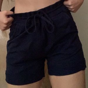 those are large navy blue shorts, with full coverage!